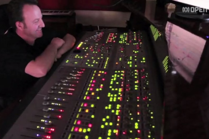 A mixing desk lights up for sound engineer Pete Mihalaras