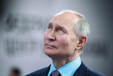 Vladimir Putin looking contemplatively upwards 
