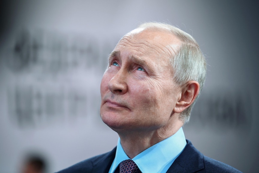 Vladimir Putin looking contemplatively upwards 