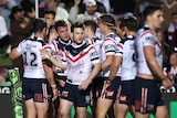 A rugby league team celebrates a try 