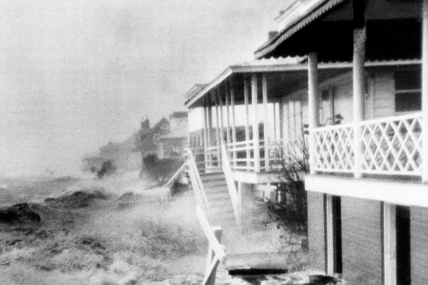 rough seas smash a two storey home on the coast