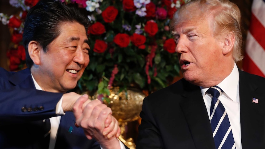 Donald Trump and Shinzo Abe shake hands