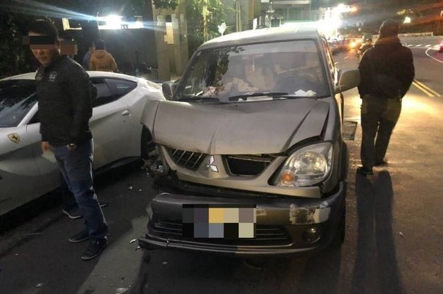 The Lin family's mangled Mitsubishi delivery van.