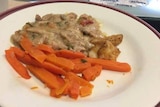 Carrots and gravy on a plate