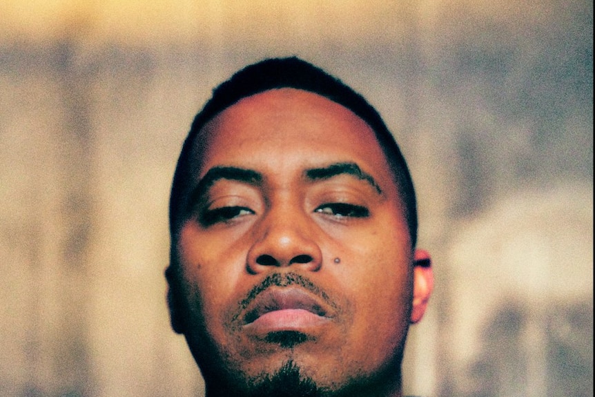The rapper Nas looks at the camera