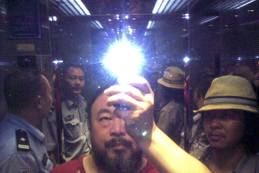 Ai Weiwei's Illumination 2014 shows him taking a selfie while being arrested by Chinese police