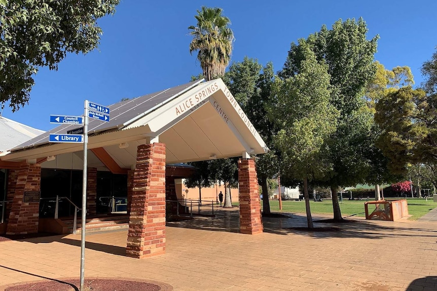 The brick exterior of the Alice Springs Town Council is seen on a sunny day.