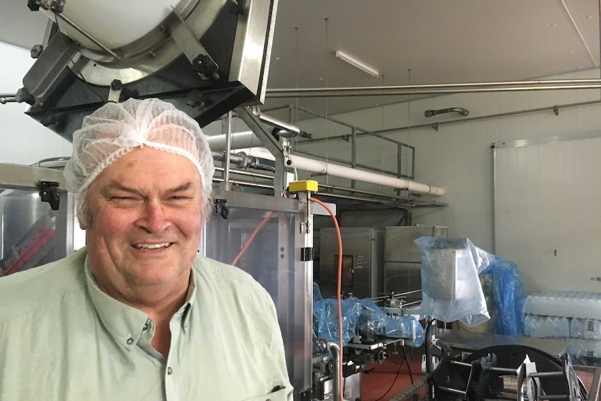 Dick Schroder smiling in his factory.