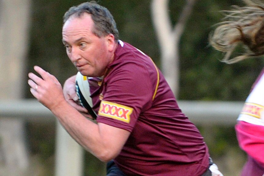 Senator Barnaby Joyce plays in a Federal Members State of Origin Touch Football match.