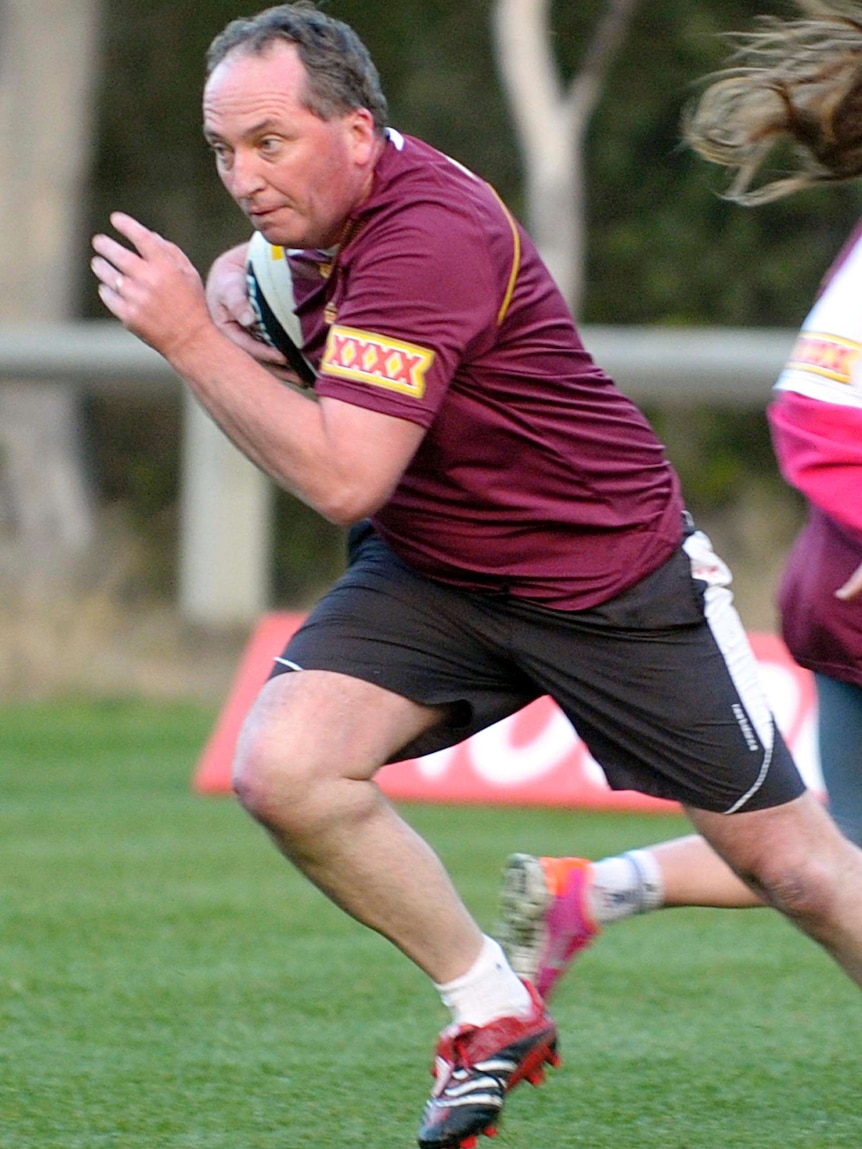 Senator Barnaby Joyce plays in a Federal Members State of Origin Touch Football match.