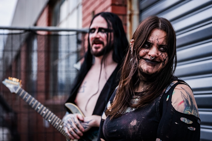 Metal band Scaphis standing outside and smiling 