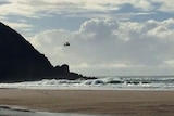 Rescue helicopter searches for missing surfer at Cape Byron