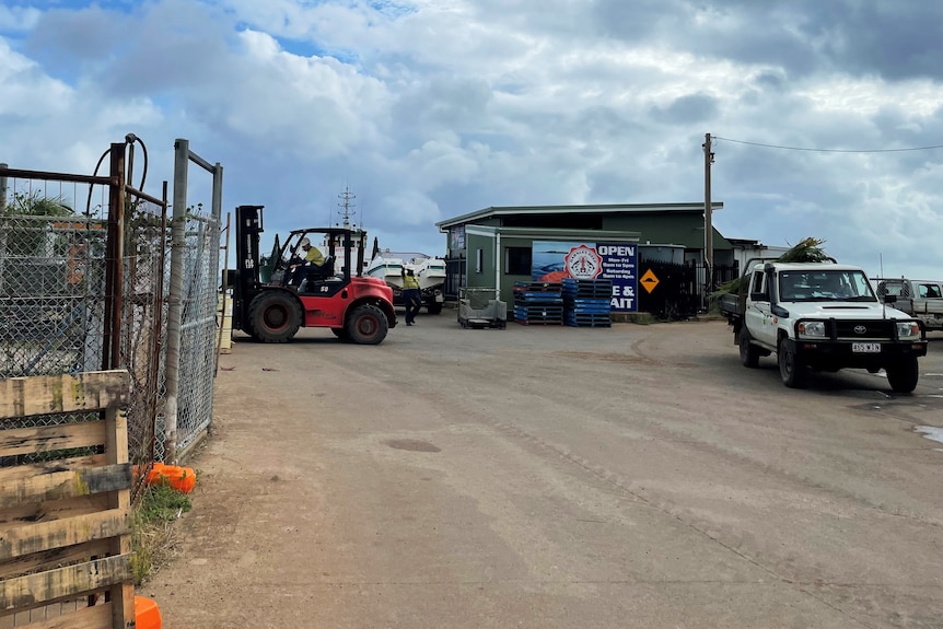 Forklift unloads goods from barge