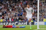 On target ... Cristiano Ronaldo celebrates after scoring Real Madrid's third goal