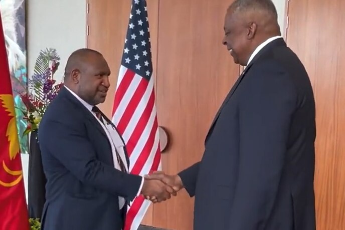 Secretary of Defence Lloyd Austin shakes hand of PNG Prime Minister James Marape in Port Moresby