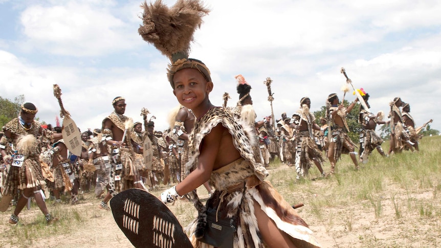 Dancers wear Chinese-made, spotted capes designed by conservationists to reduce demand for the real thing