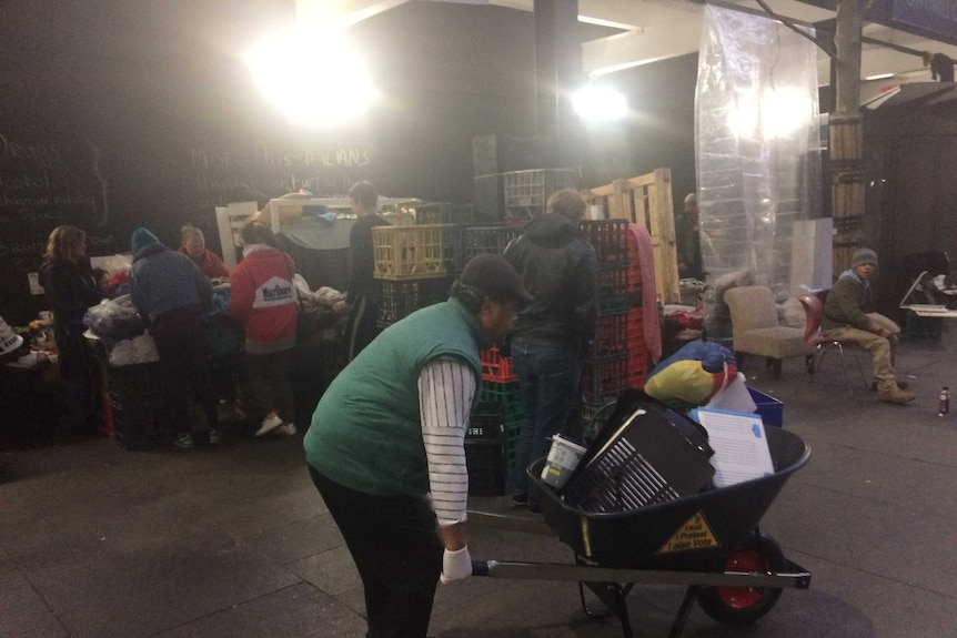 Homeless with a wheelbarrow.