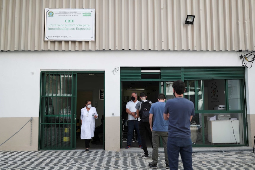 People line up in Brazil for trials of a potential coronavirus vaccine developed by Oxford University.