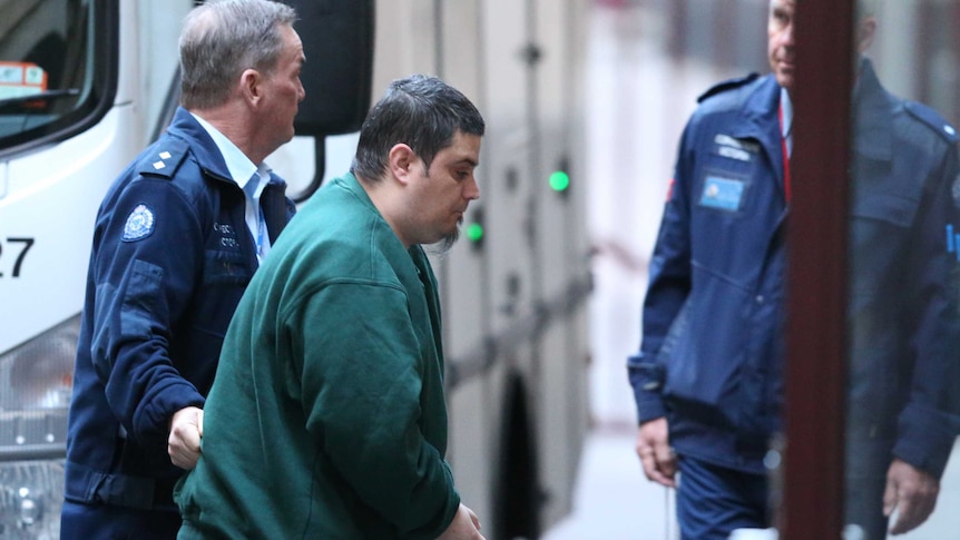 Mohamed Naddaf is seen leaving a prison van as he enters the Supreme court in Melbourne.