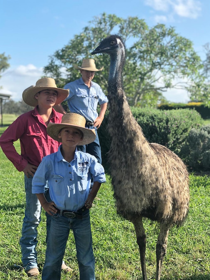 McArthur children stand next to Fred the Emu.