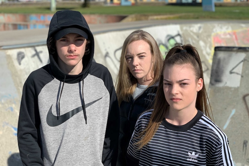 Ella Howells (C) and her sister Lilli with brother Mason Cooper at skate park.