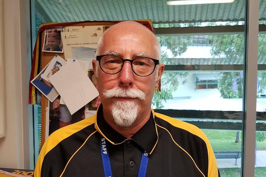 A photo of Darwin Middle School teacher Tony Vanderwey standing in a classroom.