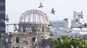 Doves flutter over gutted A-bomb dome at A-bomb anniversary in Hiroshima. (Yuriko Nakao: Reuters, file photo)