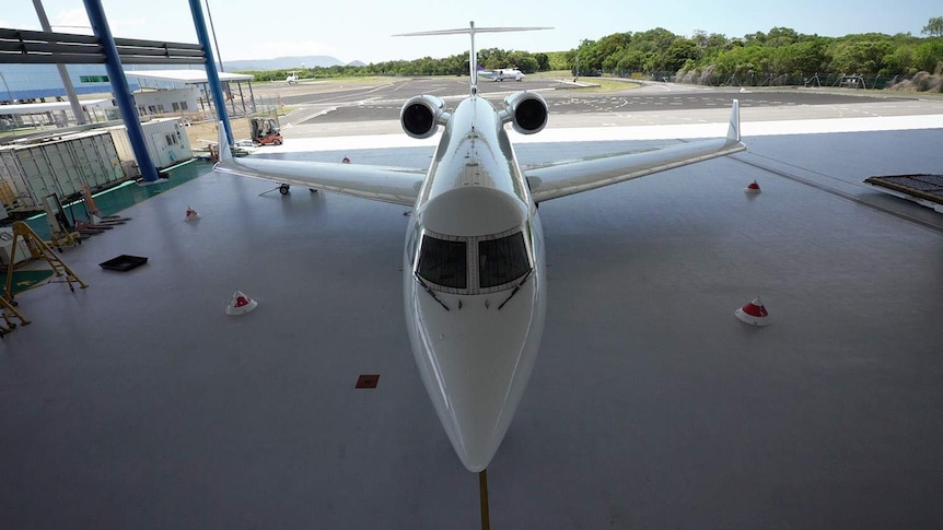 A Gulfstream jet inside a hangar