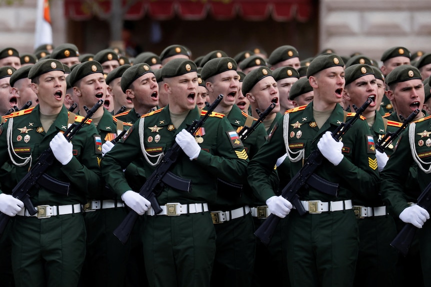 Russian service members take part in a military parade on Victory Day