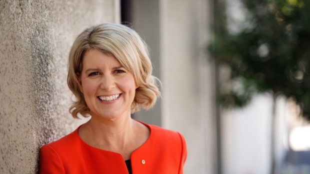 Natasha Stott Despoja AM, Chair of the board of Our Watch Australia, in a red suit