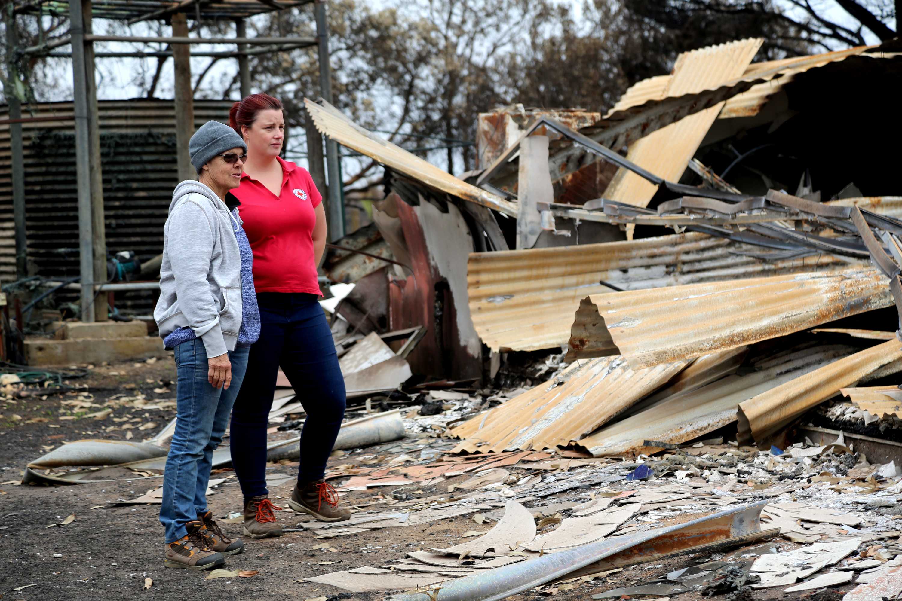 A Red Cross volunteer with a bushfire victim