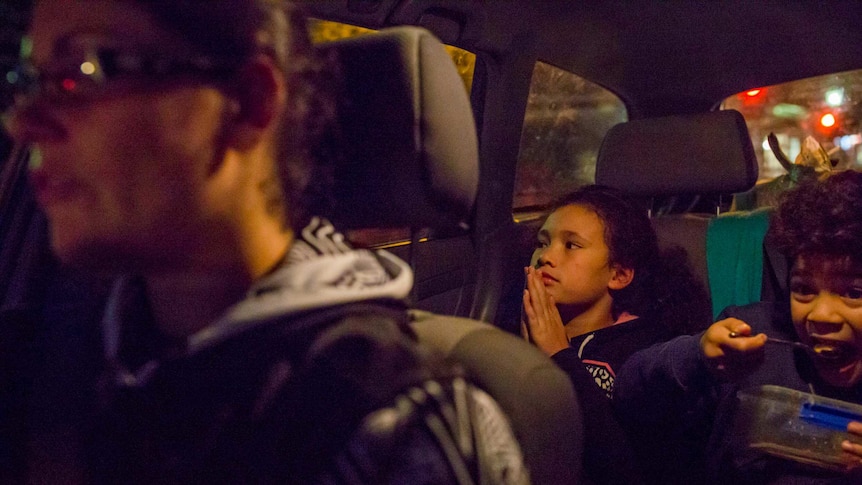 Thompson's seven-year-old twins Jaida and Soane in the back seat of a car.