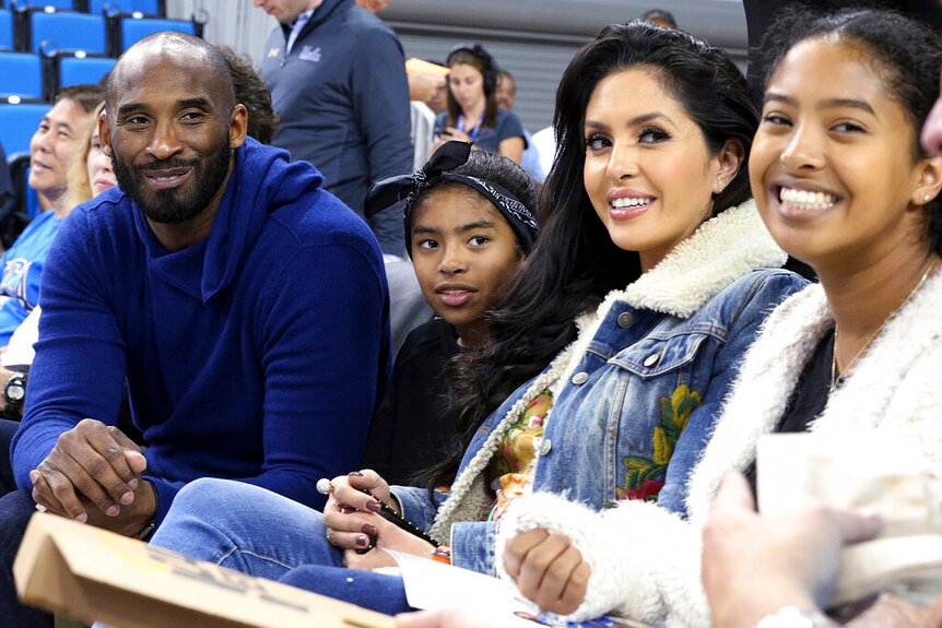 Kobe Bryant with his family and wife at a basketball game in Los Angeles.
