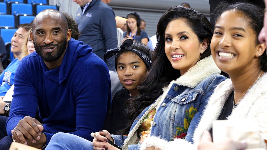 Kobe Bryant with his family and wife at a basketball game in Los Angels.