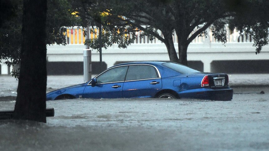 Car submerged in flood waters in Brisbane
