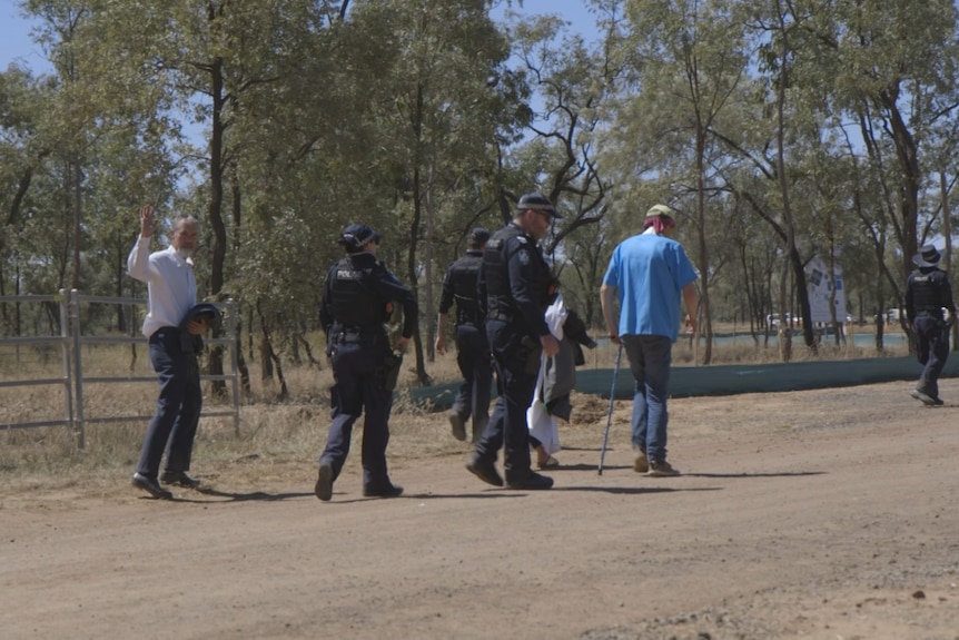 Several members of ARRCC getting taken by police after being arrested at the Adani site.