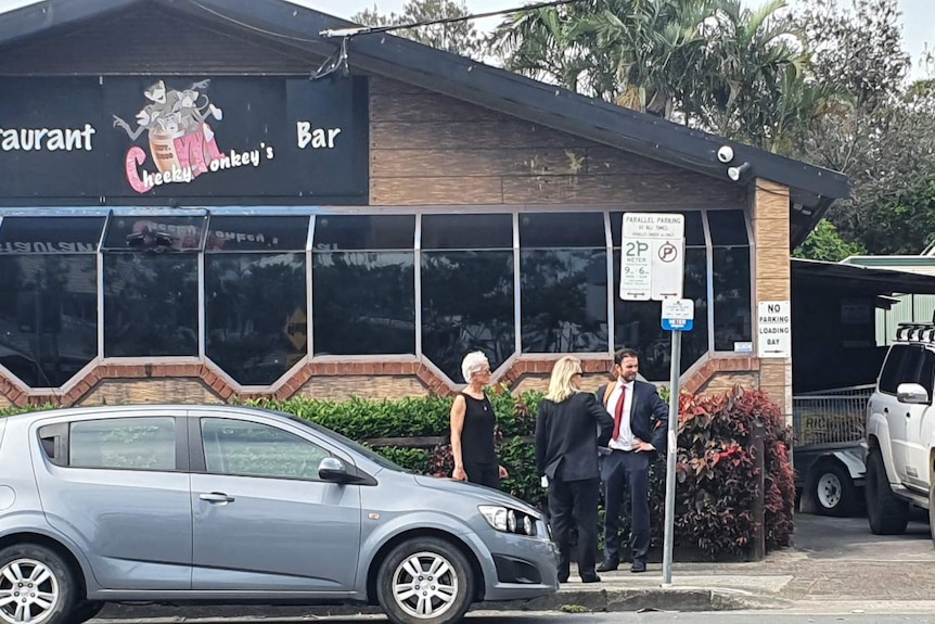 Coroner and staff standing on street outside Byron Bay nightclub 