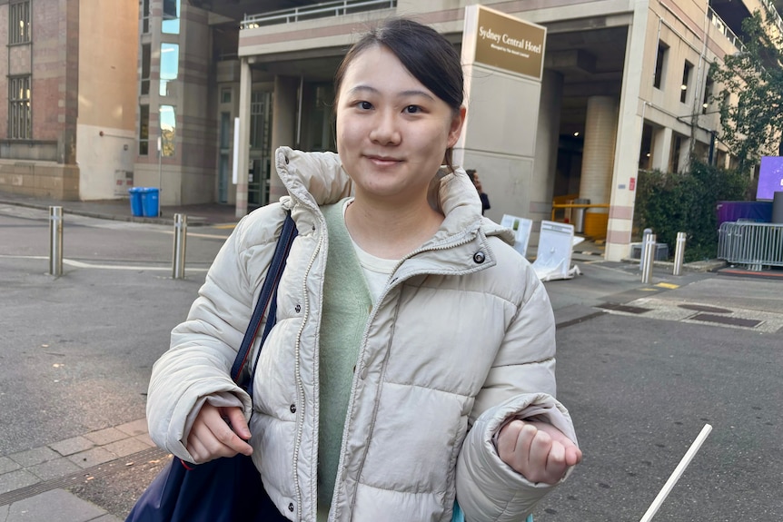 Student Gillian Yuyu stands in the street.