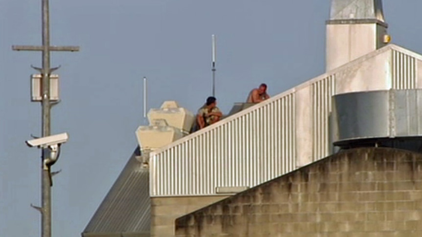 Two prisoners protest on roof of Brisbane Correctional Centre