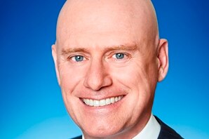 Headshot of Liberal MP Sean L'Estrange with a blue background.