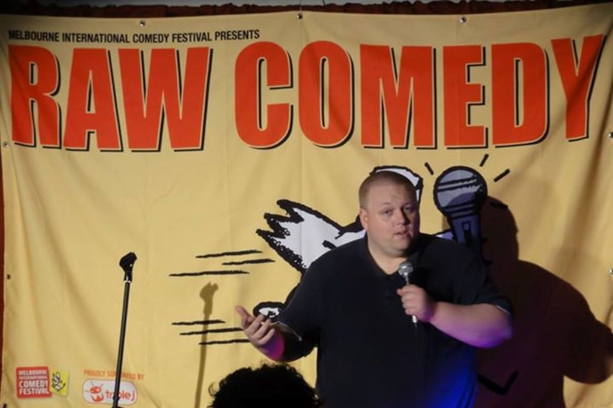 Ben Klingberg performing at a Raw Comedy festival in Hobart.