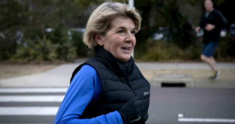Julie Bishop smiles as she completes her morning jog