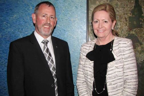 Gary Stevenson stands wearing a suit and tie alongside City of Perth Mayor Lisa Scaffidi.