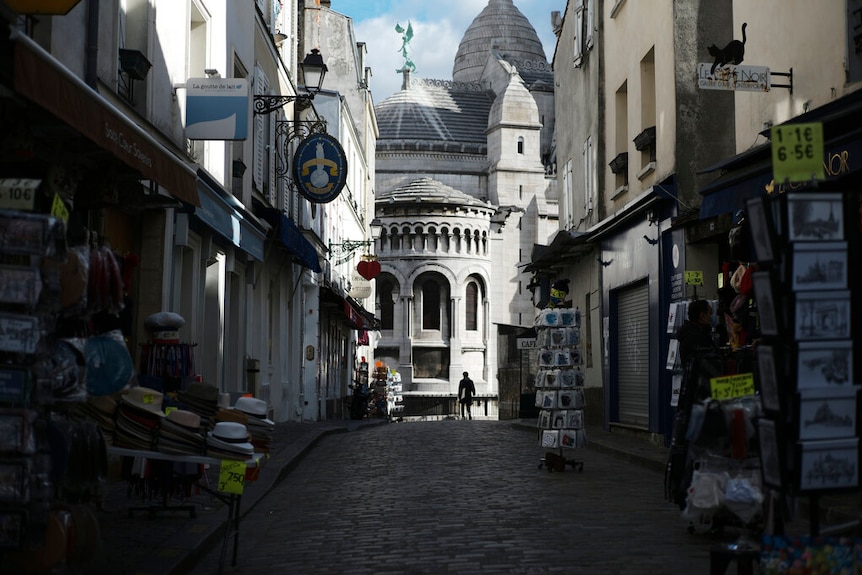 Tourists shops are empty in a deserted street just outside the Sacre Coeur basilica in the Montmartre district of Paris.