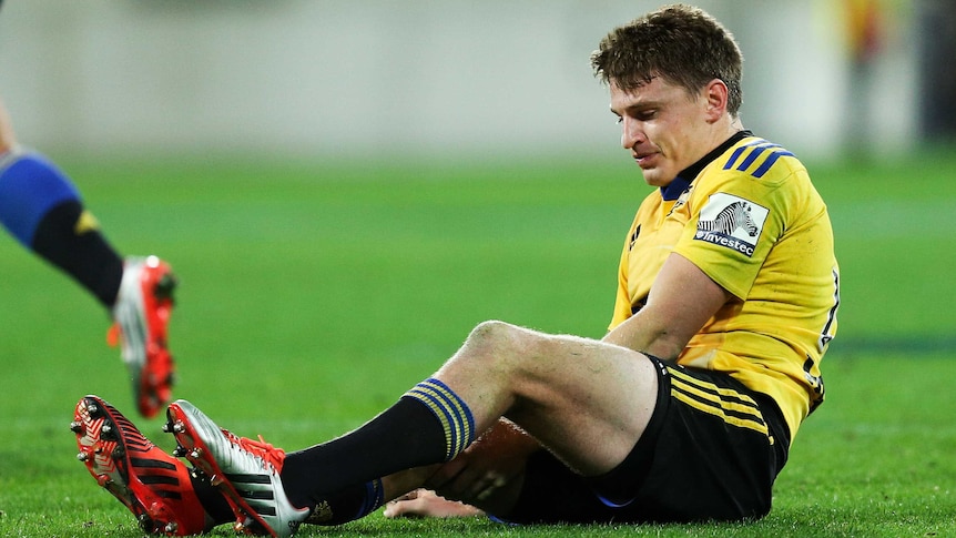 The Hurricanes' Beauden Barrett injures his leg against the Crusaders in Wellington on May 2, 2015.