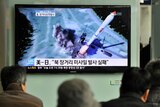 South Koreans in Seoul watch rocket launch.