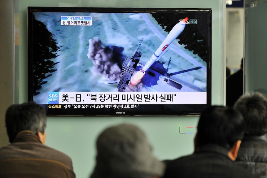 South Koreans in Seoul watch rocket launch.