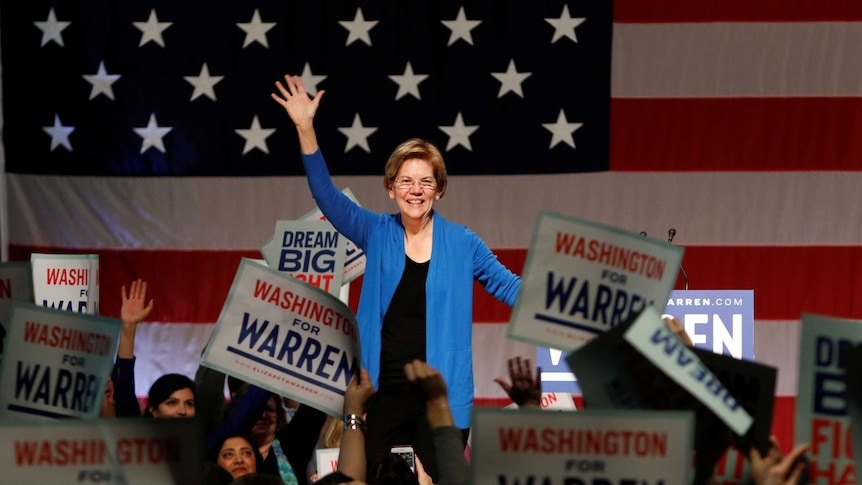 Elizabeth Warren waves to a crowd of supporters.