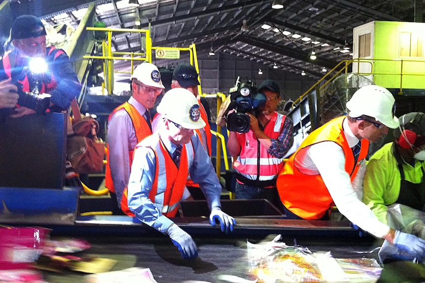 LtoR Mr Newman and Mr Abbott at the VISY recycling plant at Gibson Island in Brisbane on February 24.