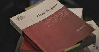 A close up photograph shows the cover of a final report.